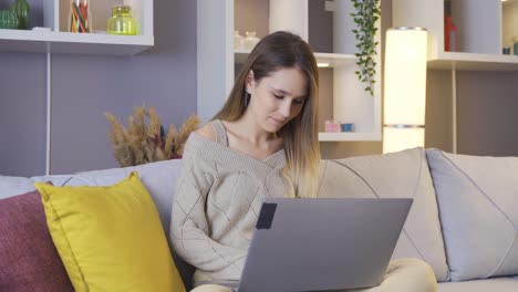 Young-woman-working-with-laptop-at-home.